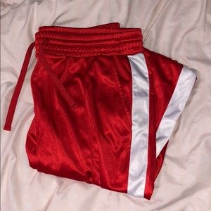 Red track pants